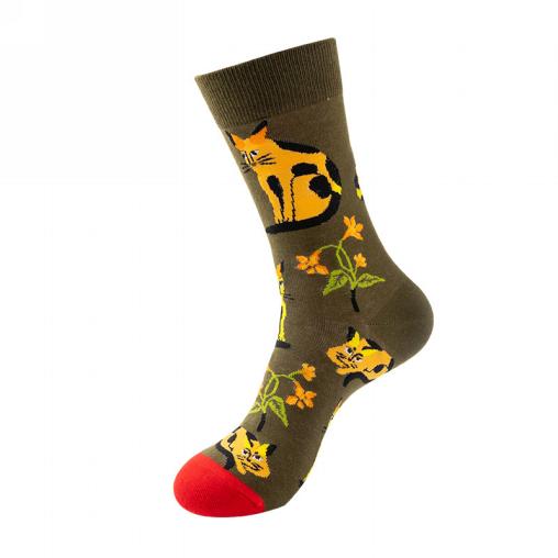 Sock with cat design on a green bakcground