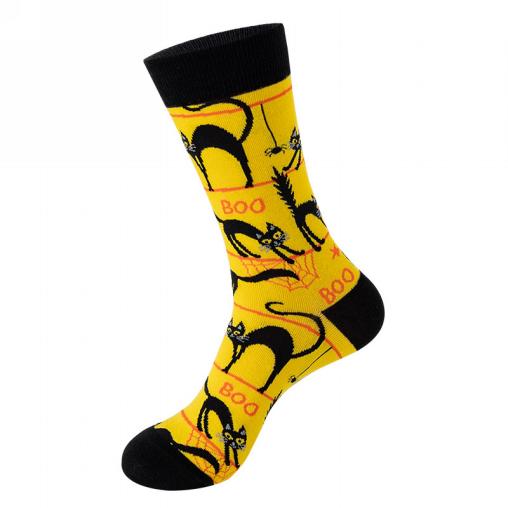Yellow sock with black cat designs and 'BOO' text on a white background
